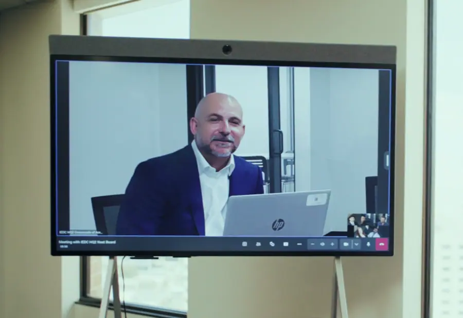 All-in-one meeting display showing a remote participant on a video call