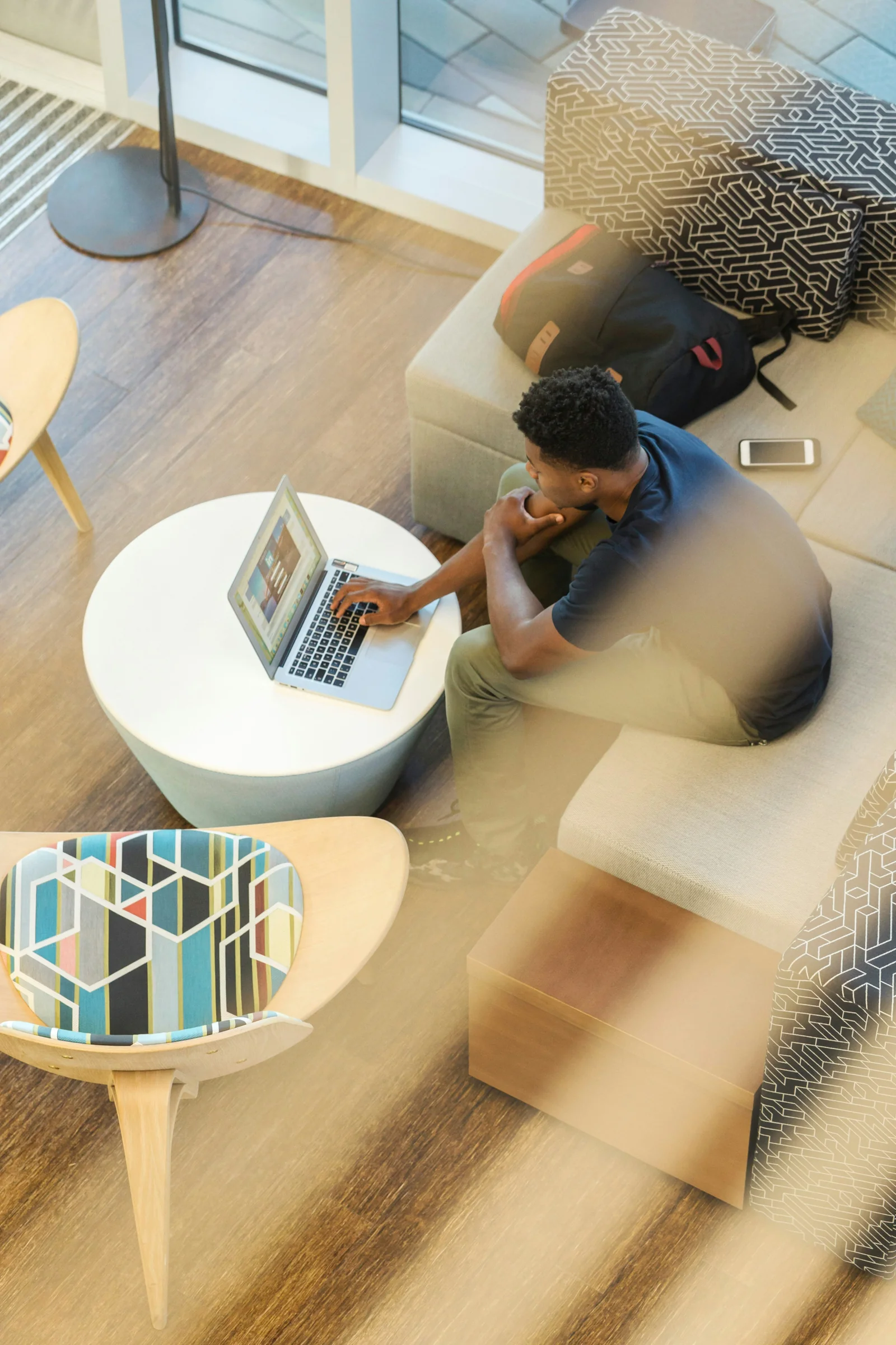 Working on a laptop in lounge seating
