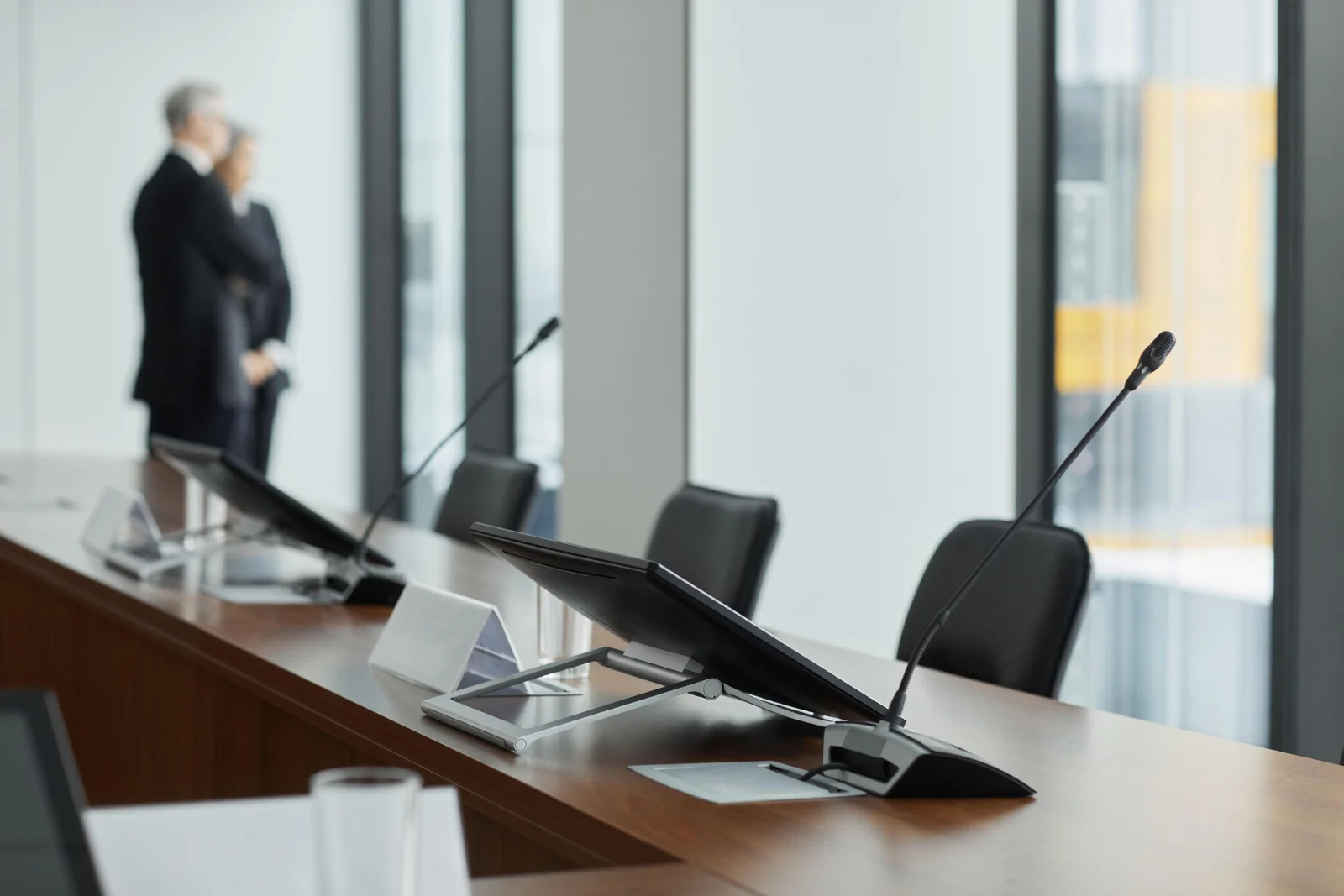 Gooseneck microphones on a panel table