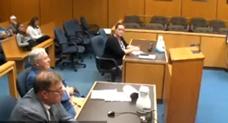 Courtroom camera view of attorneys